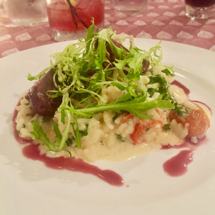 This delicious starter of wood pigeon, tomato and kale risotto and sticky red wine reduction.