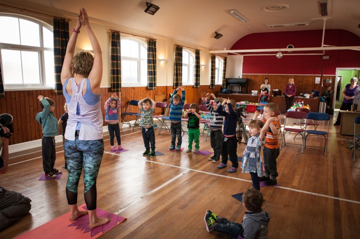 Bliss Yoga teacher at front