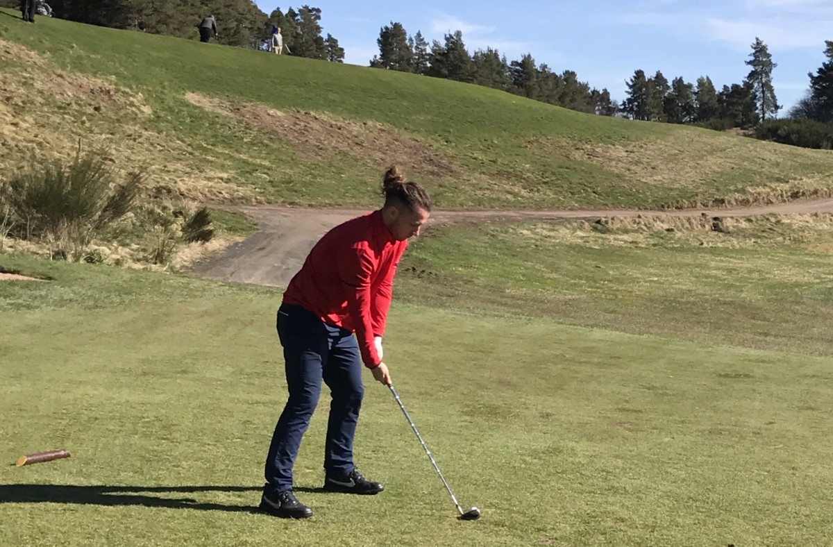 Stevie May teeing off