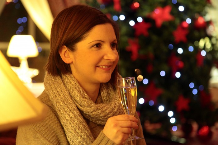 Green Hotel woman with champagne