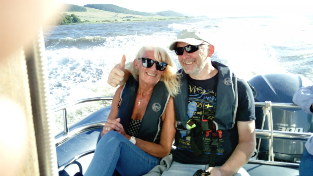 Couple enjoying the ocean breeze on the River Tay