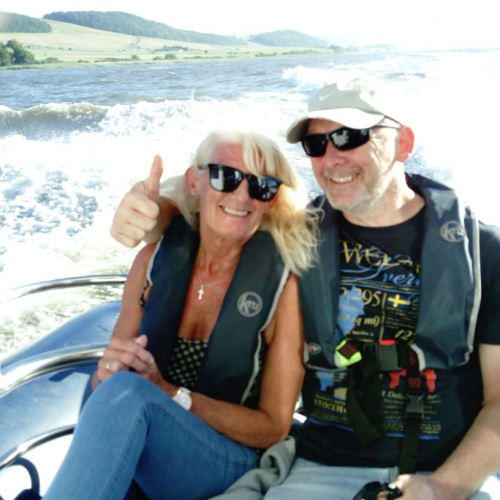 Couple enjoying the ocean breeze on the River Tay