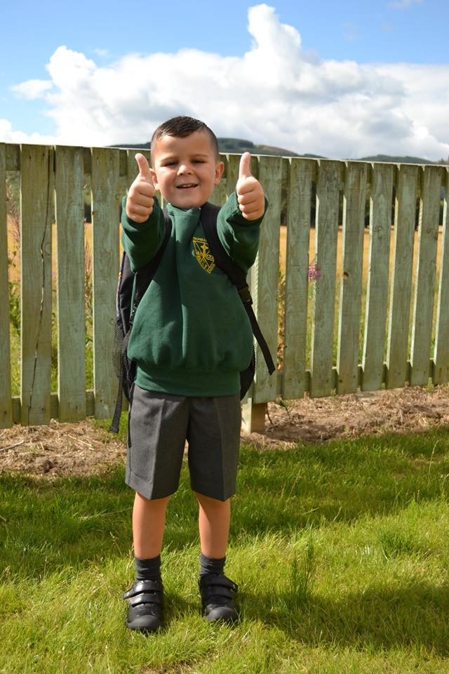 Ben puts his thumbs up in excitement as he starts his first day of Primary one at Dunbarney Primary, Perth