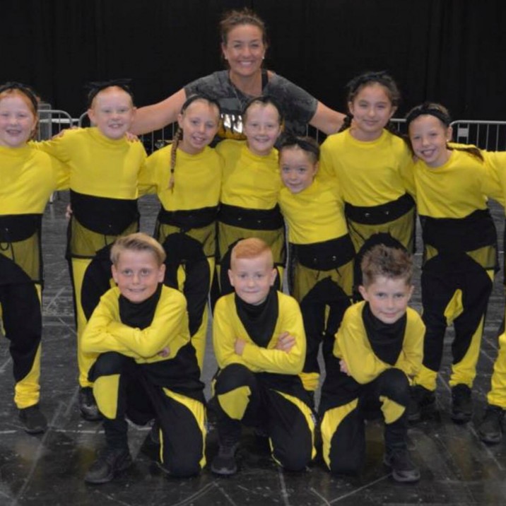 An elated J Crew 2 with their super proud coach!