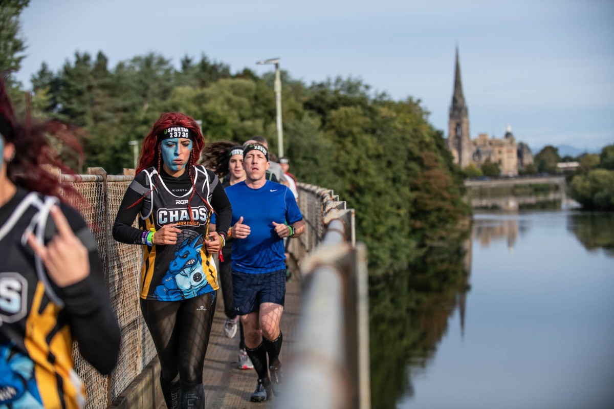 Spartan runners tackling the railway bridge.