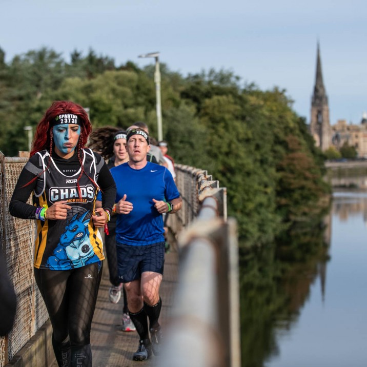 Spartan runners tackling the railway bridge.