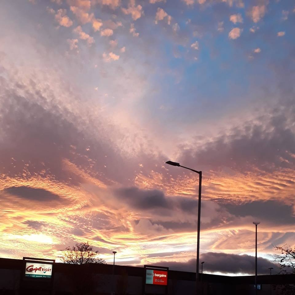 A burst of colourful clouds from the light blue evening sky captured by Rachel Scott.