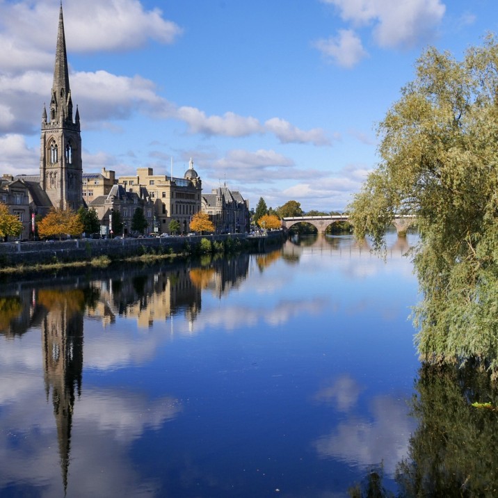 The mystical views of the reflective River Tay taken from Queens Bridge in Perth city Center looking towards Tay Street