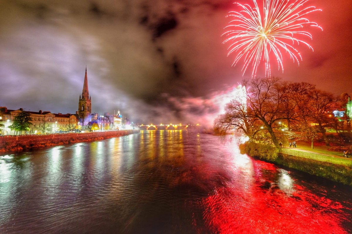 The River Tay lit up reflecting the bright Christmas colours of the city from the outstanding fireworks display which closed the Perth Christmas lights switch on party