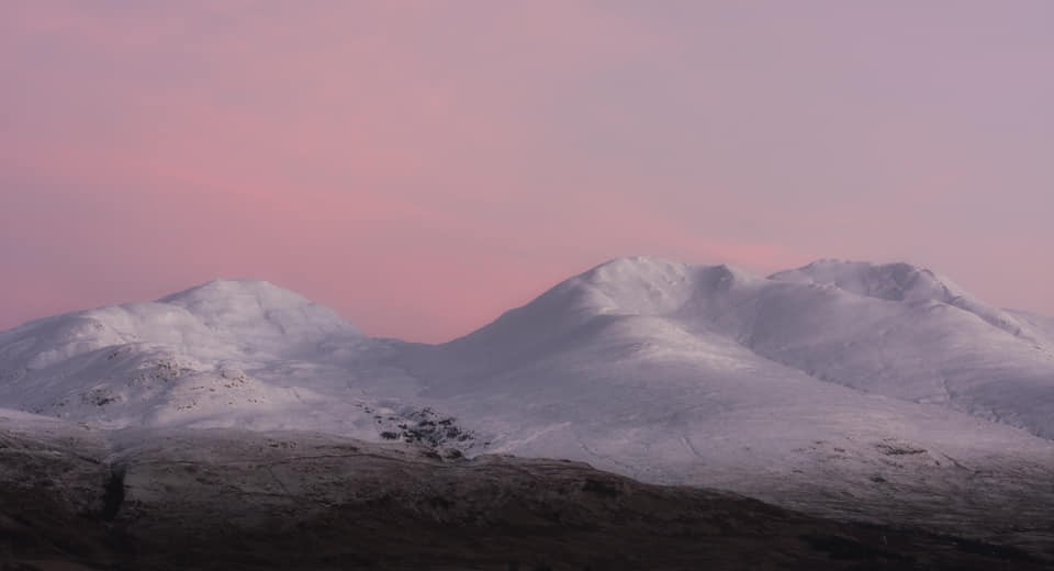 A gorgeous photograph of a red sky morning at Ben Lawers and Beinn Ghlas, Perthshire by Katherine Fotheringham
