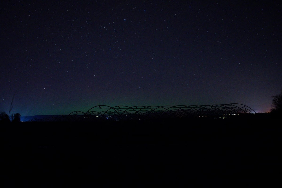 When blue scattered light is set against an environment heavy in red light (for example, during sunset) and a dark grey cloud, the may sky appear faintly green.