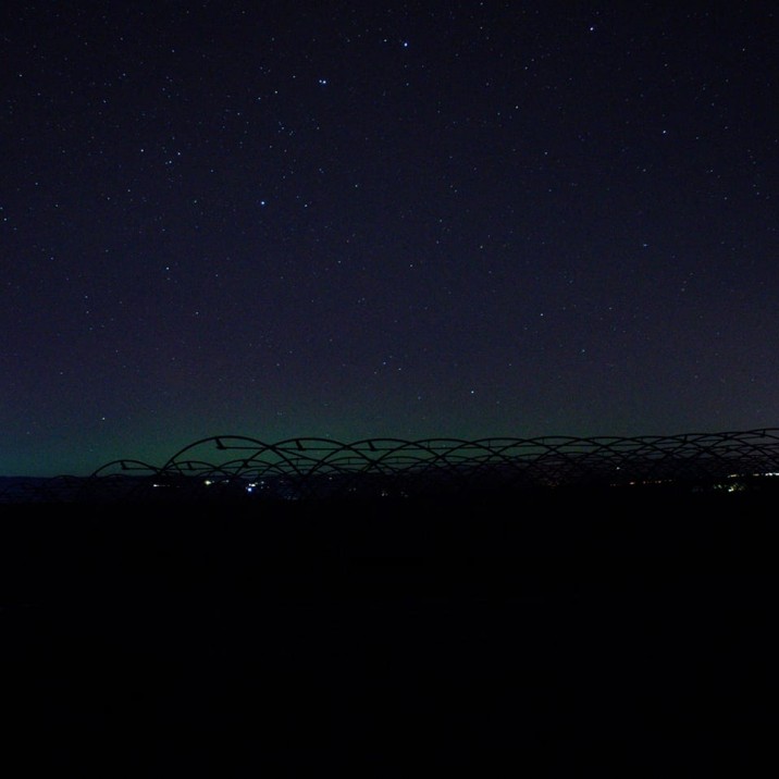 When blue scattered light is set against an environment heavy in red light (for example, during sunset) and a dark grey cloud, the may sky appear faintly green.