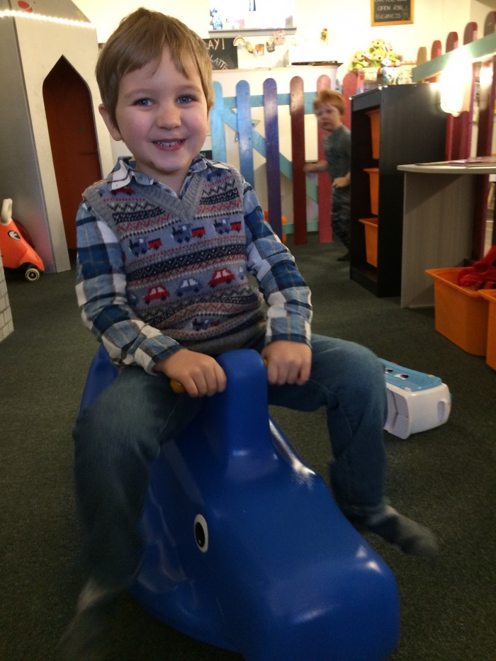James enjoying a play date with a whale see-saw at Cafe Play!