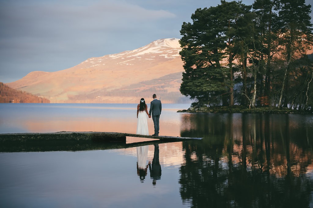 What a beautiful wedding picture by the calm water at Kenmore.