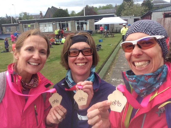 Sally and her friends proudly posing with their medals!