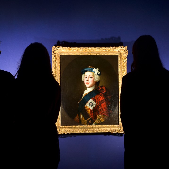 JACOBITE CLANS 19 group of people study portrait of Bonnie Prince Charlie.