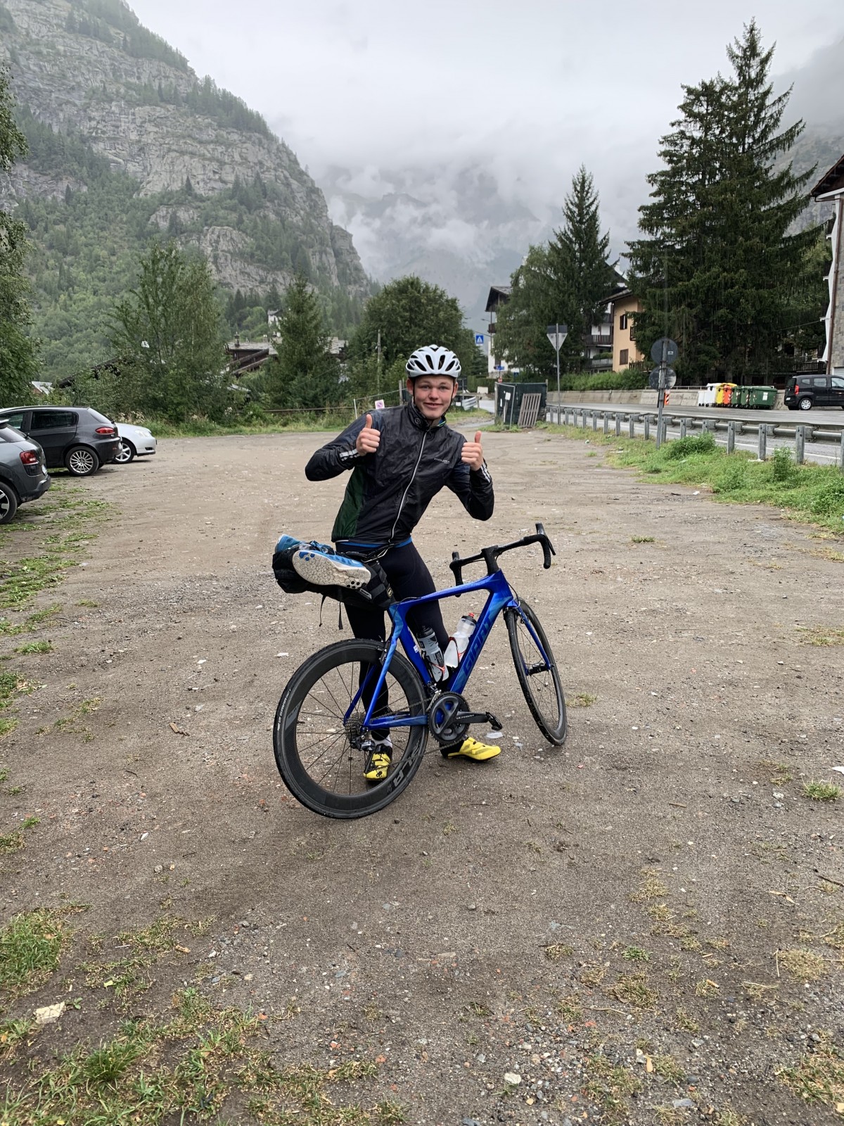 "Me pretending that the weather is good before the first ride in Italy.  It was freezing and was raining hard." - Olly