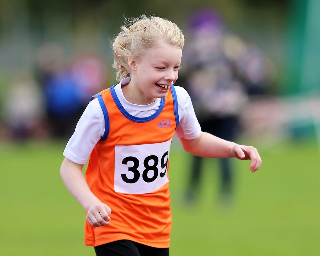 Ella Dixon having great fun competing in the 100m.