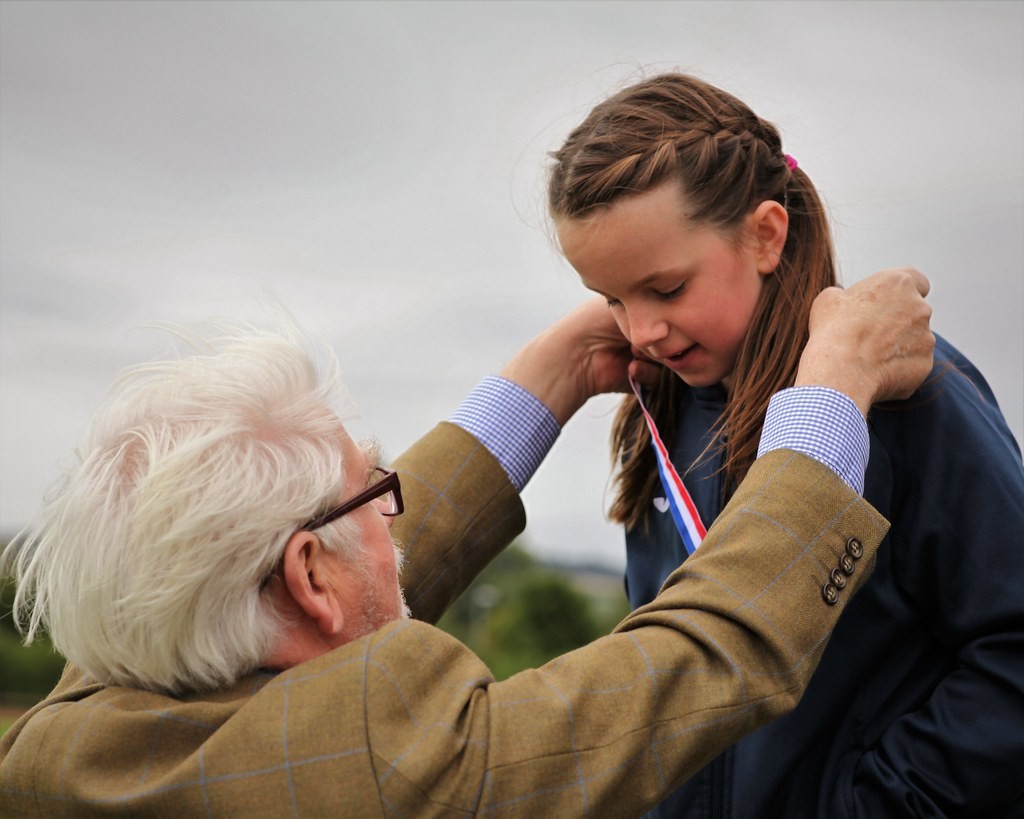 Perth & Kinross Provost Dennis Melloy presenting Perth endurance athlete, Mhairi Gatherer with her gold medal.