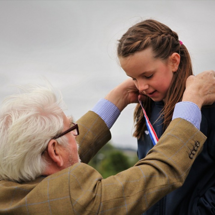 Perth & Kinross Provost Dennis Melloy presenting Perth endurance athlete, Mhairi Gatherer with her gold medal.