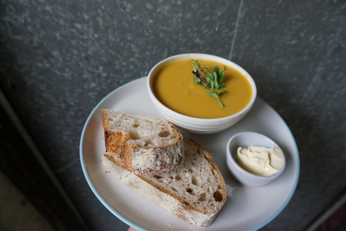 Butternut squash, coconut and ginger soup with sourdough bread by Wild Heart Bakery.