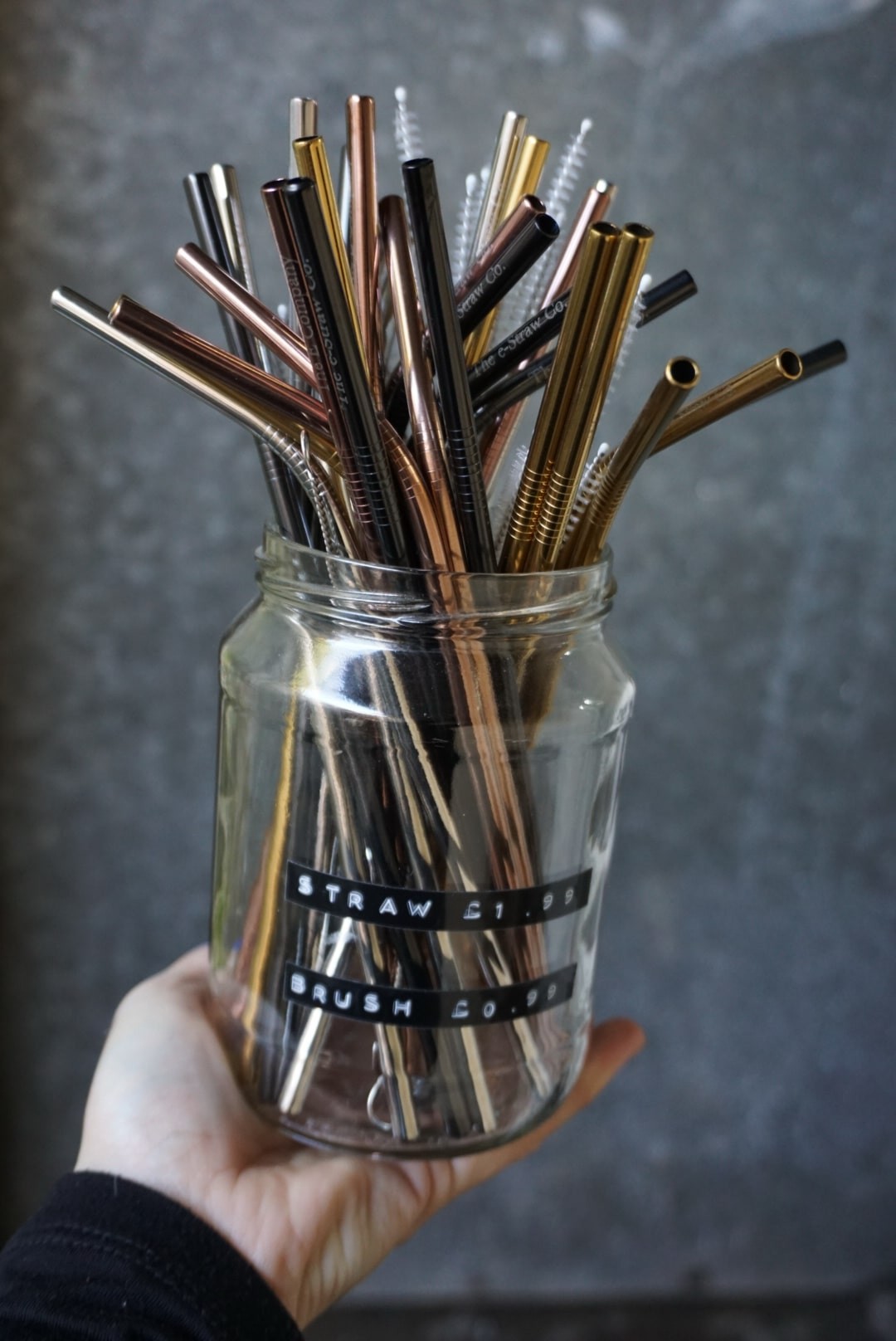 Reusable stainless steel straws and cleaning brushes.