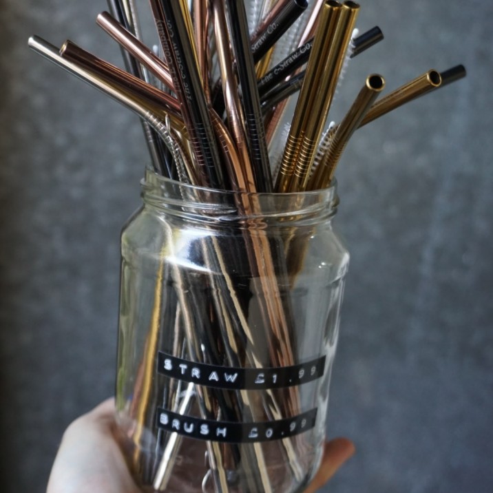 Reusable stainless steel straws and cleaning brushes.