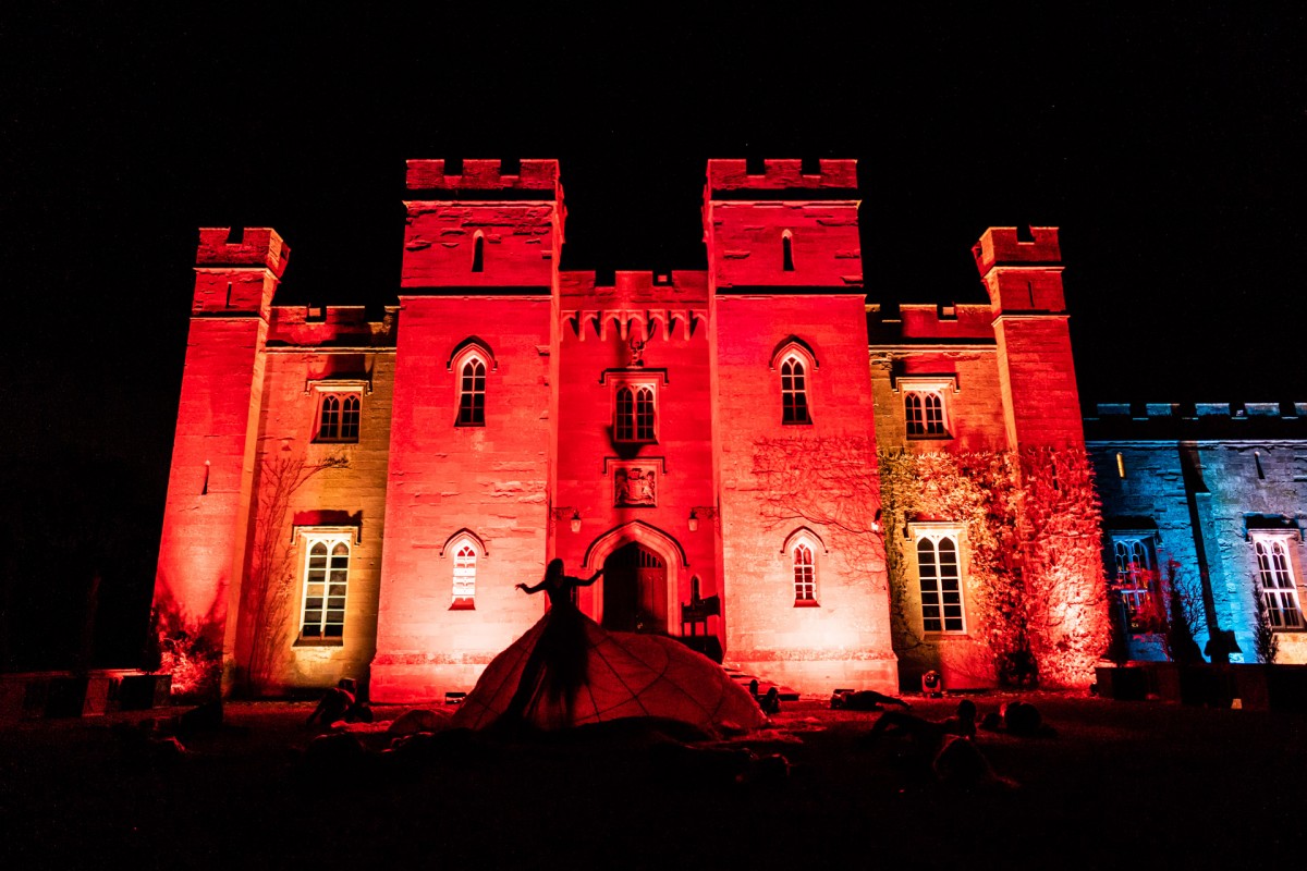 The Haunted Lady creeps past a stunning Scone Palace swathed in demon red.