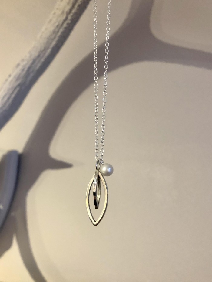 A beautiful sterling silver snowdrop pendant designed and made by Linda Byers at Byers & Co