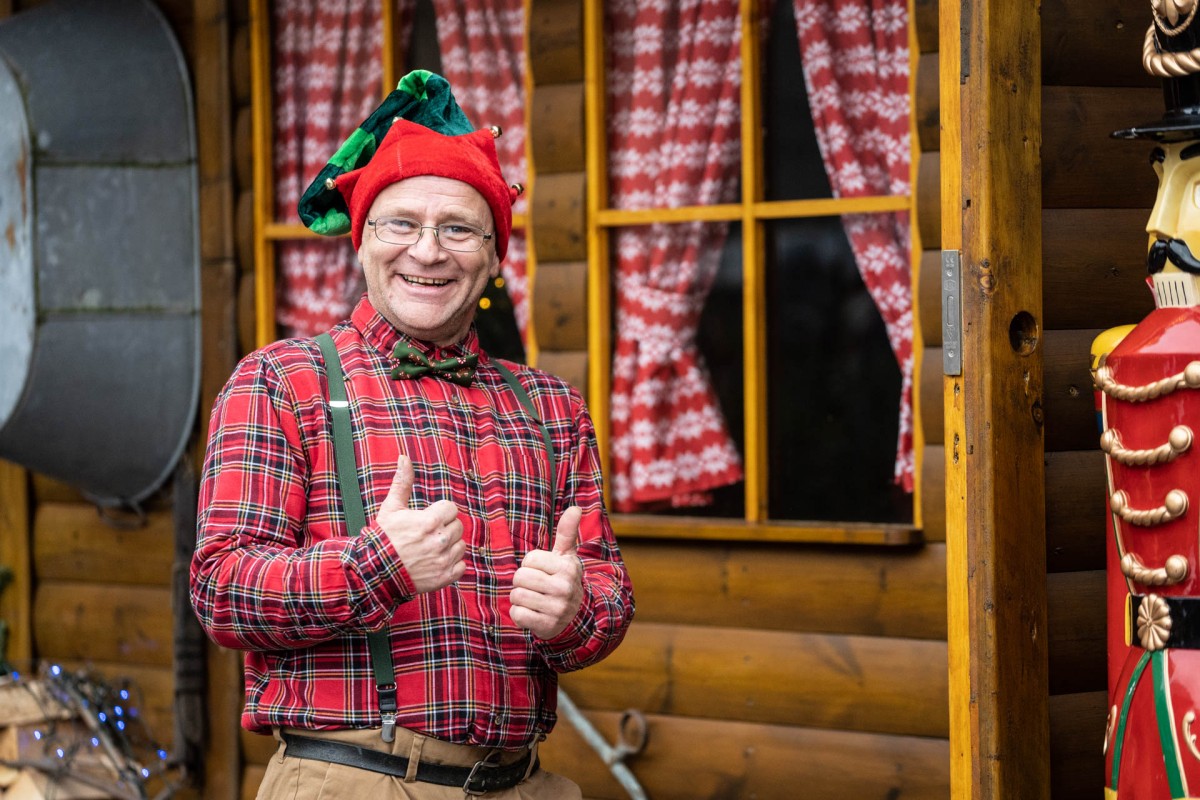 All smiles! This elf love's his job.