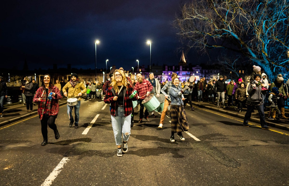 The Rhythm Wave Band making their way over the Queens Bridge.
